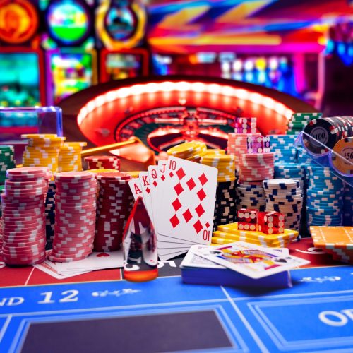 Casino set with Roulette, cards, dice and chips on BlackJack mat